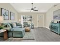 Bright and airy living room with vaulted ceiling, comfortable seating, and lots of natural light at 416 Lancaster Ave, Orange City, FL 32763