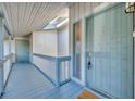 Hallway entrance with light blue doors, light wood paneling, and a transom skylight at 5036 Sherwood Ln # 3945-6, Haines City, FL 33844