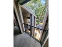 View of balcony with black metal railing overlooking the street and other units at 5064 Park Central Dr # 1731, Orlando, FL 32839