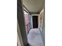 Balcony view showing the entrance to the unit with a black door and a white-framed window at 5064 Park Central Dr # 1731, Orlando, FL 32839