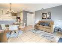 Cozy living room with dining area and neutral tones, creating a welcoming space at 619 Lake Marion Golf Resort, Kissimmee, FL 34759