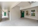 Condo exterior with a green front door and neutral-colored siding, offering a welcoming entrance at 640 Cranes Way # 164, Altamonte Springs, FL 32701