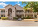 Exterior view of condos with a No Parking sign in front and mature landscaping surrounding the complex at 640 Cranes Way # 164, Altamonte Springs, FL 32701