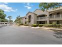 Inviting condo complex with well-manicured grounds, easy parking, and a glimpse of a community pool at 640 Cranes Way # 164, Altamonte Springs, FL 32701