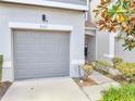 Attached single-car garage showcasing a modern panel door with house number 9161 at 9161 Shepton St, Orlando, FL 32825