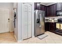 Modern kitchen featuring stainless steel appliances, ample cabinet space and tile flooring at 9189 Shepton St, Orlando, FL 32825