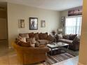 Comfortable living room with tile floors, neutral paint, and modern decor at 117 Anzio Dr, Kissimmee, FL 34758