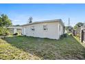 The spacious backyard has a serene setting with potential for landscaping at 1716 2Nd Ne St, Winter Haven, FL 33881