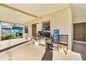 Covered carport with space for entertaining, featuring a charming side entrance at 1716 2Nd Ne St, Winter Haven, FL 33881