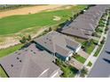 Overhead view of homes near a golf course offering a picturesque community and neighborhood setting at 1830 Estuary Ln, Kissimmee, FL 34747
