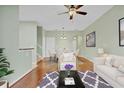 Bright living room featuring modern furnishings and hardwood floors at 2040 Retreat View Cir, Sanford, FL 32771