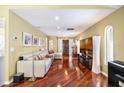 Bright living room boasts sleek hardwood floors, recessed lighting, and neutral walls for a comfortable and welcoming space at 250 Cortland Ave, Winter Park, FL 32789