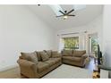 Cozy living room featuring two sofas, natural light, and neutral decor at 2900 S Semoran Blvd # 4, Orlando, FL 32822