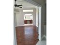 Spacious bedroom with hardwood floors, recessed lighting, a ceiling fan, and an adjoining bathroom with double vanities at 3125 Timucua Cir, Orlando, FL 32837