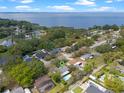 An aerial view showing the home's proximity to a large body of water and lush green surroundings at 427 N Lakeview Ave, Winter Garden, FL 34787