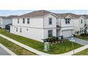 Corner lot featuring a well-maintained two-story home with lush green grass at 4361 Lana Ave, Davenport, FL 33897