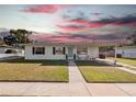 Charming single-story home with a well-maintained lawn and covered front entrance at 7108 Stockholm Way, Orlando, FL 32822