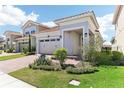 Charming single-Gathering home with a red brick driveway and well-manicured landscaping at 8006 Hoylake Dr, Orlando, FL 32832