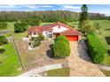 Aerial view of a house featuring a large yard and scenic landscape at 13542 Texas Woods Cir, Orlando, FL 32824