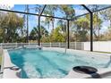 Enjoy the backyard with this large private pool and screened-in lanai at 149 St Thomas Dr, Mulberry, FL 33860