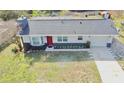 Aerial view of the house showing the yard and landscaping at 32803 Forest Ave, Leesburg, FL 34788