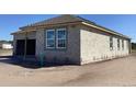 View of exterior block wall construction, windows, and garage entrance at 5754 Cattle Ranch Dr, St Cloud, FL 34771