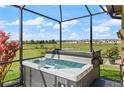 Backyard hot tub with beautiful views of the surrounding neighborhood and nearby pond at 846 Asturias Rd, Davenport, FL 33837