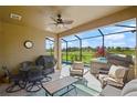 Relaxing screened lanai with comfortable seating, perfect for outdoor entertaining and views of the pool at 846 Asturias Rd, Davenport, FL 33837