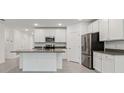 Modern kitchen featuring white cabinets, stainless steel appliances, and granite countertops at 8651 Sw 138Th St # 68, Ocala, FL 34473
