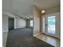 Inviting living room features neutral walls, modern ceiling fan and tile flooring at entrance at 110 Evergreen Dr, Auburndale, FL 33823