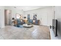 Bright living area featuring neutral walls, tile flooring, contemporary furnishings, and natural light at 13687 Sw 33Rd Cir, Ocala, FL 34473