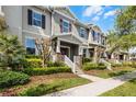 A row of townhouses with well-maintained lawns and beautiful landscaping at 15580 Blackbead St, Winter Garden, FL 34787