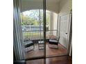 Screened in porch with tiled flooring and seating area at 2717 Maitland Crossing Way # 4-103, Orlando, FL 32810