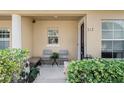 Inviting front porch seating area, perfect for relaxing outdoors at 312 Carina Cir, Sanford, FL 32773