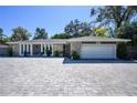 Charming single-story home boasts stone accents and a spacious paver driveway at 352 Ridgewood St, Altamonte Springs, FL 32701