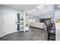 Open-concept living room features modern flooring, recessed lighting and a front door at 352 Ridgewood St, Altamonte Springs, FL 32701