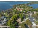 An aerial view that shows a beautiful neighborhood with mature trees and lake access at 400 W 2Nd Ave, Windermere, FL 34786