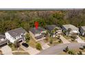 Aerial view of the home and surrounding properties with a red pin on top of the home at 4561 Cabello Loop, Kissimmee, FL 34746