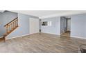 Spacious living room with staircase, modern floors, and ample closet space at 4907 Silver Oaks Vlg # D, Orlando, FL 32808