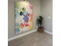 Colorful Mickey Mouse artwork on display, adding a touch of whimsy and personality to the entryway at 8008 Formosa Valley Pl, Kissimmee, FL 34747