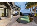 An entertainer's backyard featuring a covered patio with a built-in grill and a private swimming pool at 801 W 2Nd Ave, Windermere, FL 34786