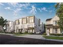 View of new townhomes on brick-paved street, showcasing modern architecture and landscaping at 1002 E Robinson St # 1, Orlando, FL 32801