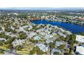 Picturesque aerial view showcasing the community's layout, surrounding trees, and serene lake at 1033 S Hiawassee Rd # 2628, Orlando, FL 32835