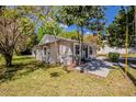 Side view of the house showing the yard, fresh paint, windows and outdoor space at 1306 Shepherd Ave, Sanford, FL 32771