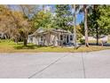 Street view of cozy home featuring freshly painted exterior and well-maintained landscaping at 1306 Shepherd Ave, Sanford, FL 32771