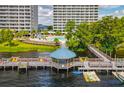 Picturesque waterfront condo with a dock, gazebo, boat, and kayak access for outdoor activities at 13427 Blue Heron Beach Dr # 103, Orlando, FL 32821