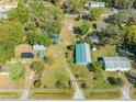 Spacious lot featuring a main house, outbuildings, landscaping, and generous yard space at 15765 Sunflower Trl, Orlando, FL 32828