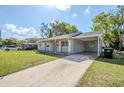 A charming single-Gathering home is showcased, complete with a convenient carport and well-maintained lawn at 5210 Grandview Dr, Orlando, FL 32808