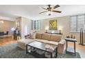 A comfortable sectional sits on a patterned rug, near to a wooden floor and a dining table at 530 E Central Blvd # 501, Orlando, FL 32801