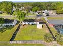 Aerial view of the fenced backyard showcasing the playset and storage shed at 536 Ellerbe Way, Lakeland, FL 33801